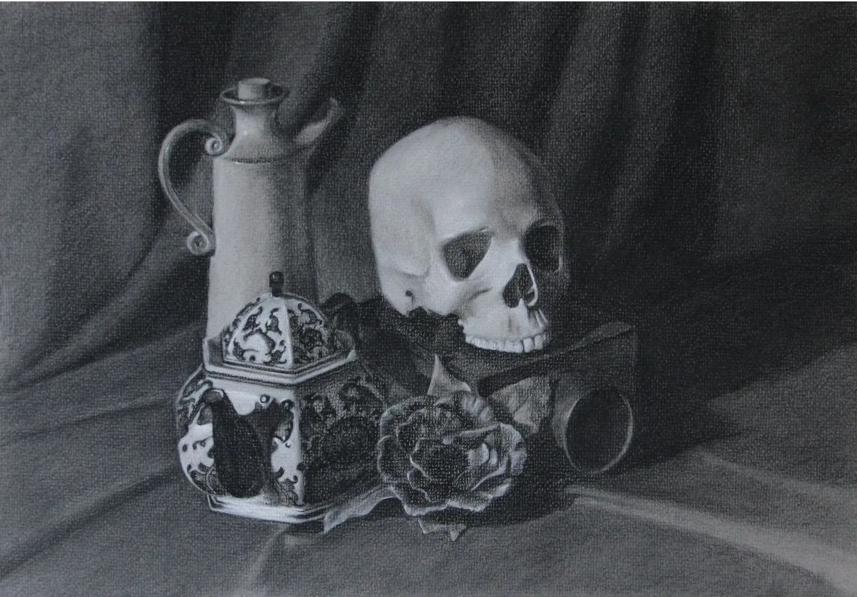 Charcoal still life of a human skull, an ornamented urn, a rose, and a blue-and-white caddy on draped cloth, by Julie Crawford