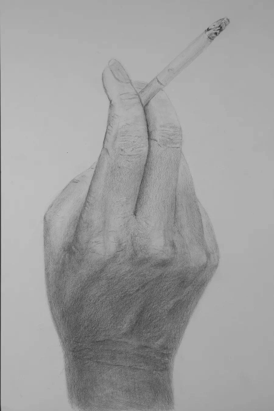 Graphite study of a hand held upright, holding a lit cigarette between two fingers with a long ash.