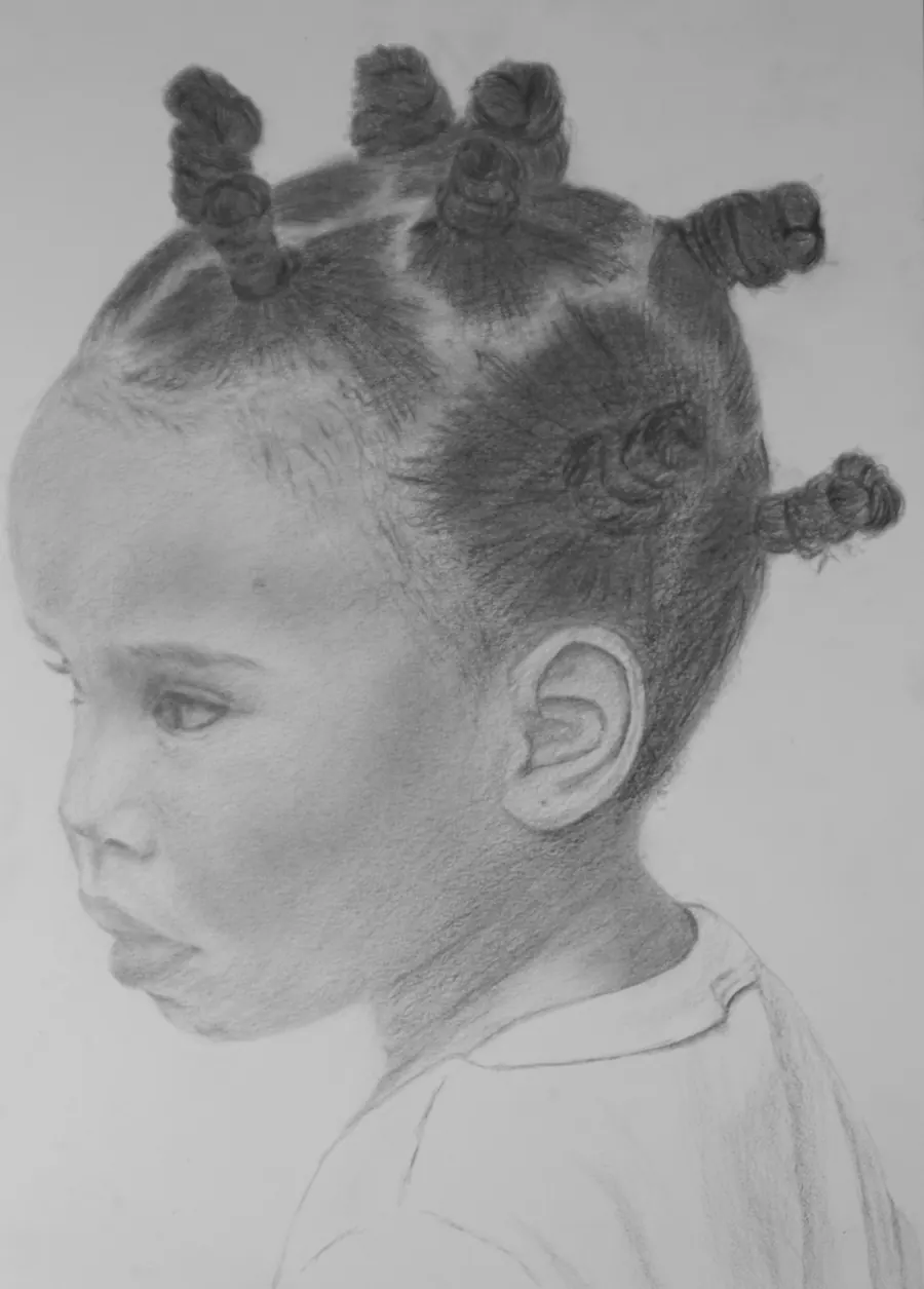 Graphite profile portrait of a small child with hair in knotted buns, lips pursed.