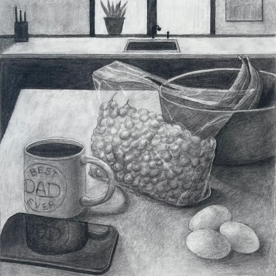 Charcoal still life on a kitchen counter: a mug reading BEST DAD EVER, a full bag of popcorn, and three eggs, with a window and sink behind.
