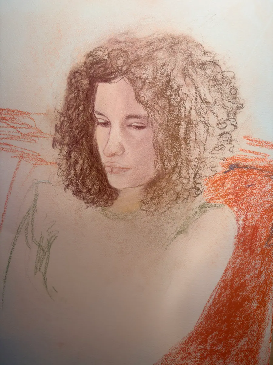 Pastel and coloured pencil portrait of a woman with curling auburn hair looking down, her shoulders dissolving into loose orange strokes.